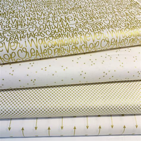 metallic fabric gold|white fabric with gold accents.